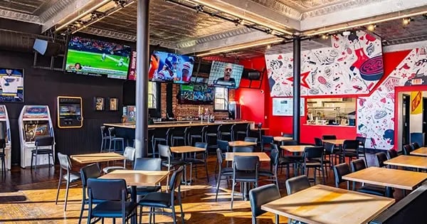 The dining room, bar, and food window at The Key STL