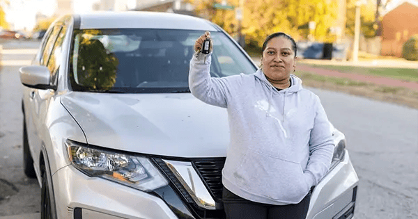 Sandra Morales and the car she was able to buy thanks to LifeWise's lending circle.