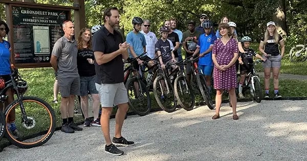 Ryan Hanlon speaks at the opening of Federer’s Folly, the city's first mountain biking trail.